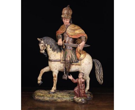 A Late 15th/Early 16th Century Nether-Rheinish Polychromed Wood Carving. A figure group depicting Saint Martin of Tours depic