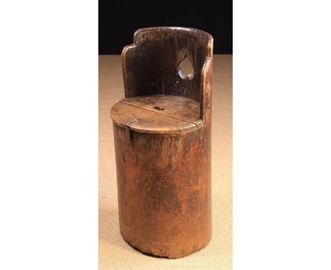 A 19th Century Dug-out Tub Seat/Bin. The hollowed out tree trunk section having a raised back pierced with an inverted heart 