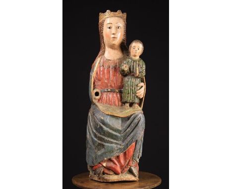 A Polychromed Wood Carving of Madonna &amp; Child, 15th Century,  Pyrenees. Mary depicted seated wearing a crown and a long r