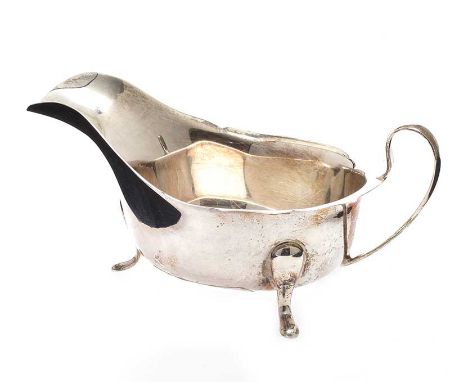 SILVER SAUCE BOAT ON THREE PAD FEET.SHEFFIELD 1944.HEIGHT: 2 INCHES.APPROXIMATELY 4 TROY OUNCES.