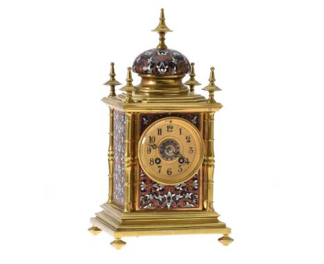 FRENCH BRASS AND CLOISONNE MANTLE CLOCK WITH CIRCULAR DIAL ON FOUR BUN FEET.DIAMETER: 3½ INCHES.HEIGHT: 11 INCHES.WIDTH: 6 IN