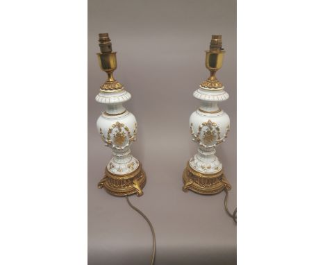 Pair Of White & Gilt Painted Ceramic Lamps
