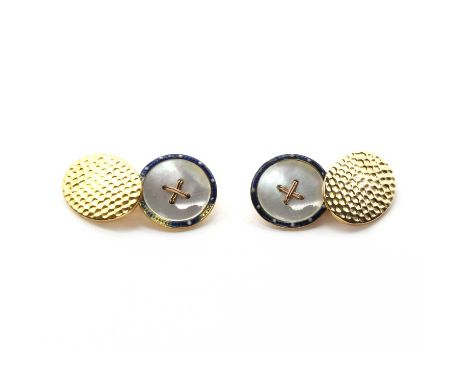 A pair of gold cufflinks, one mother-of-pearl button style link with an enamel border, and one oval link with a dimpled finis