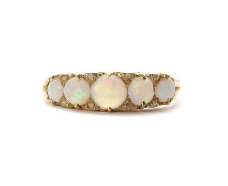 A Victorian gold five stone opal and diamond ring,five graduating round opal cabochons, claw set, to rose cut diamond set poi