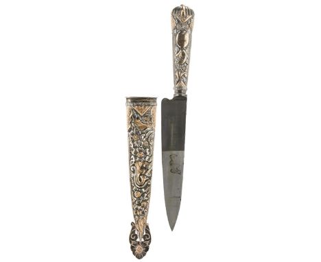 A YELLOW AND WHITE METAL MOUNTED ARGENTINIAN GAUCHO KNIFE, 15.5cm blade with faceted back edge struck with a maker's mark, ch