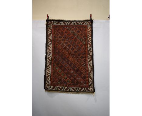 Baluchi rug with all over diamond lattice, Khorasan, north east Persia, circa 1900, 4ft. 7in. x 3ft. 1in. 1.40m. x 0.94m. Ove