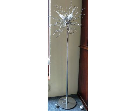 A modernistic chromed standard lamp
