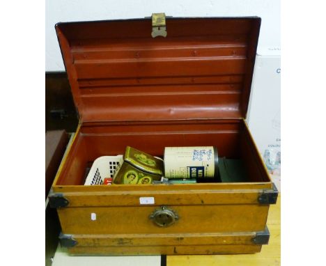 A metal trunk with contents of vintage tins, cash box etc