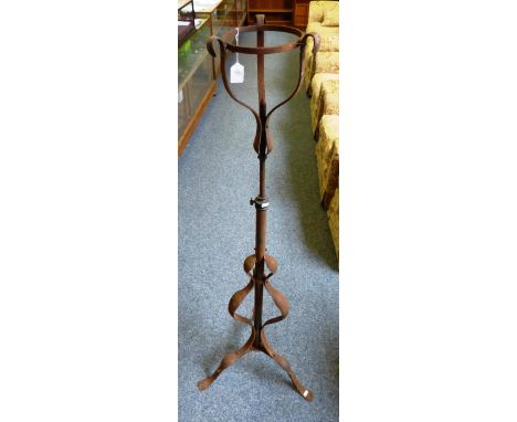 A wrought iron telescopic oil lamp stand 