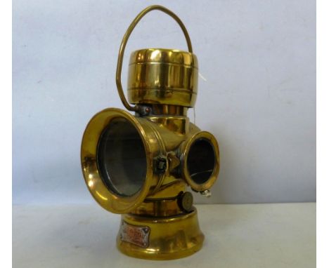 A brass Lucas King of the Road lamp no.63