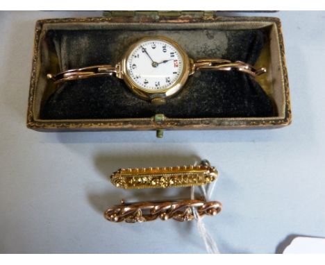 A 9ct gold lady's manual wind wristwatch (cased), together with 15ct bar brooch and a 9ct bar brooch (3)