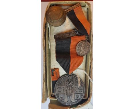 A 1917 to 1921 Service Medal (Black and Tan) in original presentation box, along with Ribbon, a 1917-1921 Miniature Service M