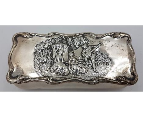 Edwardian Silver Trinket Box which is embossed with a man playing a musical instrument to two women, with a hinged lid and gi