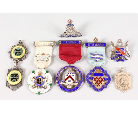 EIGHT VARIOUS SILVER AND ENAMEL MEDALS AND PENDANTS.