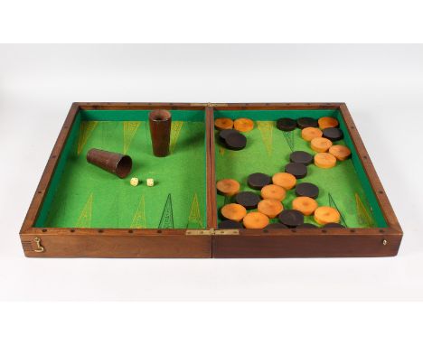 A BACKGAMMON BOX, COUNTERS, TWO LEATHER SHAKERS AND BONE DICE.