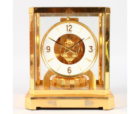 A GOOD JAEGER-LECOULTRE BRASS ATMOS CLOCK, No. 490102. 9ins high.