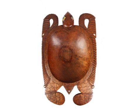 A CARVED WOOD TURTLE FEEDING BOWL with mother-of-pearl eyes. 15.5ins long x 9ins wide.
