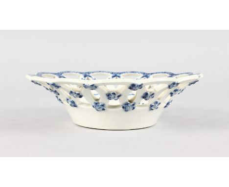 A WORCESTER PIERCED BLUE AND WHITE CIRCULAR SHAPED BASKET. 7.5ins diameter.  Crescent mark in blue.