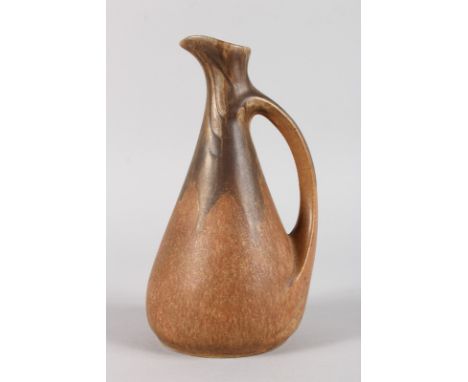 AN ART DECO SPECKLED JUG.  9ins high.