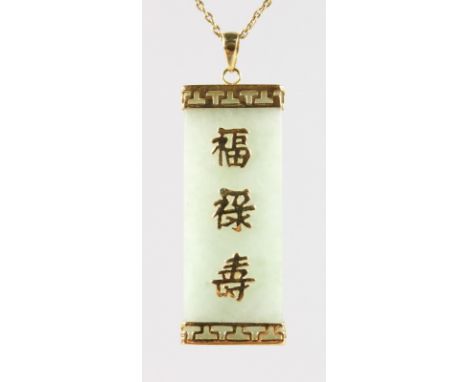 A CHINESE JADE PENDANT with gold calligraphy and chain.