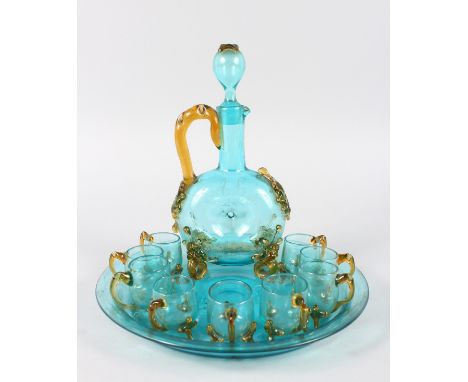 A GOOD VENETIAN COLOURED GLASS LIQUEUR SET, comprising decanter engraved AL, eight beakers and circular stand. 9.5ins diamete
