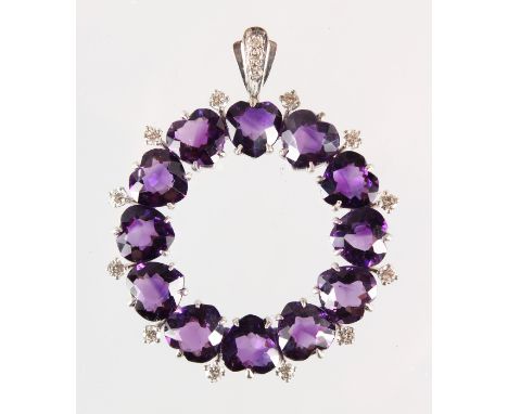 A GOOD 18CT WHITE GOLD, AMETHYST AND DIAMOND SET CIRCULAR PENDANT.