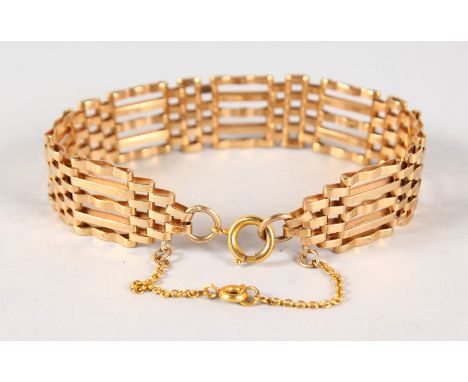 A 9CT GOLD GATE BRACELET, 16gms.