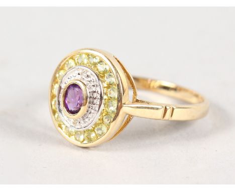 A 9CT GOLD, PERIDOT, DIAMOND AND AMETHYST RING.