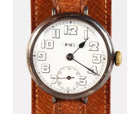 A SILVER FIRST WORLD WAR WATCH "1915" on a leather strap.