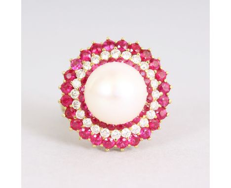 A LOVELY 18CT GOLD, RUBY AND DIAMOND CIRCULAR RING, the centre set with a PEARL.