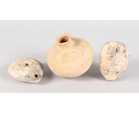 A ROMAN POTTERY VASE, 3.5ins high, A CARVED ROMAN HEAD and A LAMP (3).