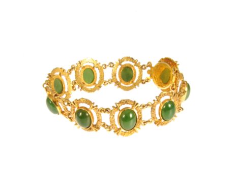 A 9 carat yellow gold bracelet, having nine individual links each set with an oval cabochon cut jade 10mm x 7mm, molten finis