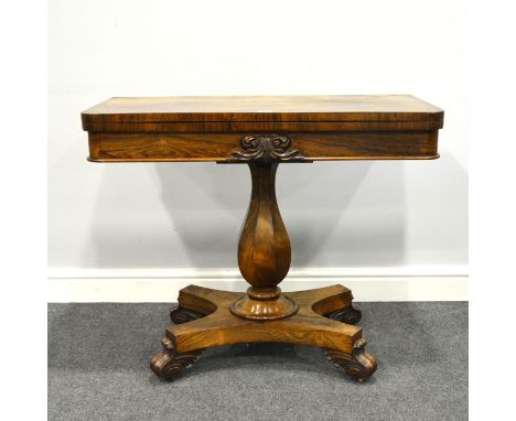 William IV rosewood fold-over card table, baize lined interior, carved frieze, octagonal pedestal, incurved platform, split t