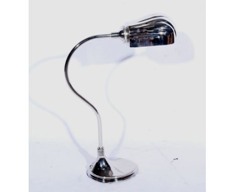 A modern nickel-plated desk lamp in the Art Deco style, the oval shell design shade on curved arm 53cm high supported on a st