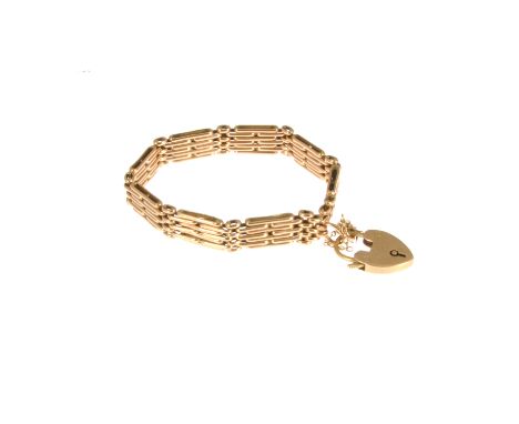 A rose metal seven bar gate link bracelet, 9mm wide, fitted with a padlock fastener, approximate weight 19.5gms.