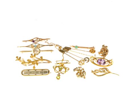 Fifteen Edwardian and later stick pins and brooches, a 9 carat yellow gold and leaf spray brooch set with four seed pearls, a