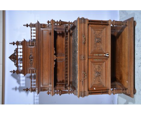 French oak dresser, the raised back with spindle gallery and a shelf with fluted columns, rectangular marble top base, two fr