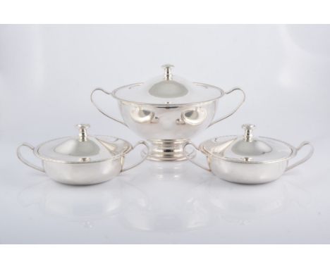 A set of three silver plated pedestal tureens, marked BMF, each with twin handles, the largest width 35cms, an oval entree di