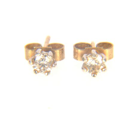 A pair of diamond single stone earrings, one brilliant cut diamond six claw set to each, in 9 carat yellow and white gold  mo