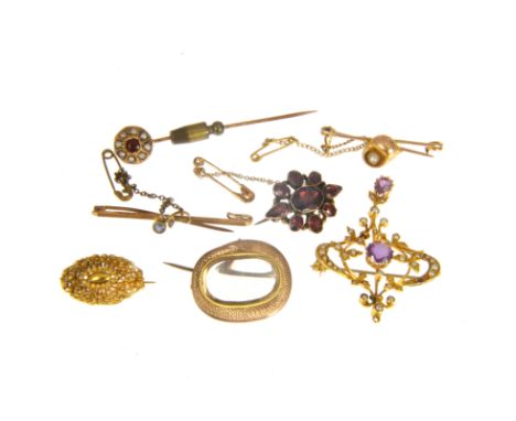 A collection of Victorian and later jewellery, an amethyst and seed pearl open framework pendant, a closed back brooch with g