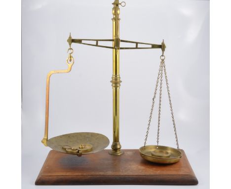 Set of Victorian brass balance scales, by W & T Avery, Birmingham, mahogany platform, width 56cm.