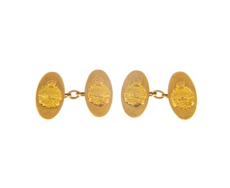 A pair of 9 carat yellow gold chain link cufflinks of military interest, the oval faces bearing the Tank Regiment insignia, h
