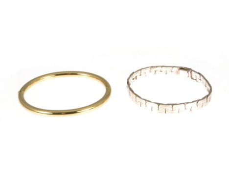 A 9 carat yellow gold half hinged bangle, 5mm wide plain polished hollow design, approximate weight 10gms, a silver 7.5mm wid