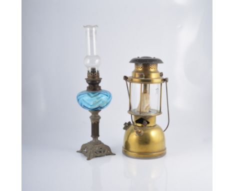 Two brass oil lamps, another lamp, and a Linthorpe style pottery lamp base (5)