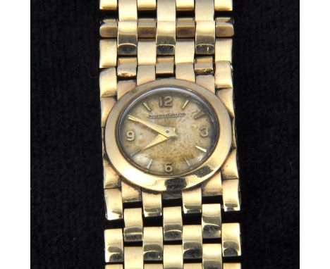 Jaeger le Coultre - A ladies 9 carat yellow gold bracelet watch, circular cream baton dial with quarter arabics in a 9 carat 