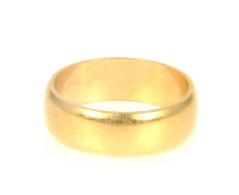 An 18 carat yellow gold wedding band, 5.8mm wide plain polished finish, approximate weight 5gms, ring size K.