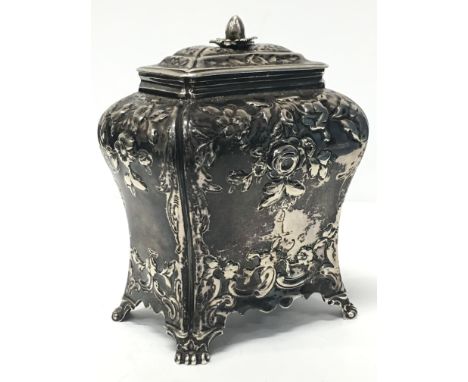 A Georgian silver tea caddy with all-over floral repousse decoration: London 1765 by Pierre Gillois. Condition Report Lid sli