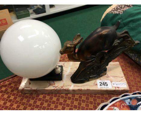 A French Art Deco table lamp on marble base with Leaping Deer mount, signed Pepin.