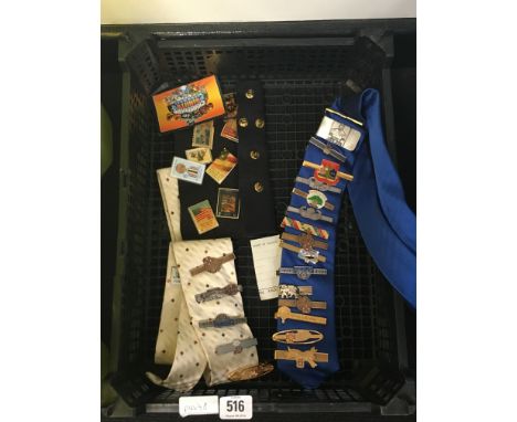 A box containing various American tie pins.