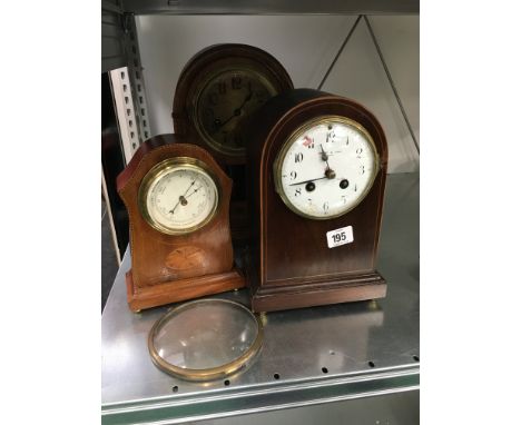 An Edwardian inlaid mahogany cased barometer together with two mantle clocks.
